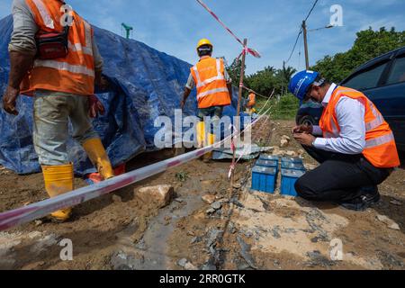 200814 -- KUALA LUMPUR, Aug. 14, 2020 -- Hakimi Razak R, a QAQC manager for China Communications Construction Company CCCC, works at a bridge construction site of the East Coast Rail Link ECRL in Pahang state, Malaysia, Aug. 12, 2020. TO GO WITH: Feature: Constructions of Malaysia s railway megaproject ECRL back to full swing with strong precautions measures against COVID-19  MALAYSIA-PAHANG-ECRL-CONSTRUCTION-RESUMPTION ZhuxWei PUBLICATIONxNOTxINxCHN Stock Photo