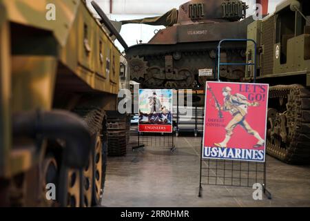 200815 -- NEW YORK, Aug. 15, 2020 -- Repurposed WWII posters adapted to the fight against COVID-19 are displayed at the Museum of American Armor in Plainview, New York, the United States, on Aug. 15, 2020. An exhibition of repurposed posters created during World War II and now adapted to the fight against COVID-19 has been held here since the museum reopened to the public on July 31, reminding visitors to be vigilant against COVID.  U.S.-NEW YORK-THE MUSEUM OF AMERICAN ARMOR-COVID-19-REPURPOSED WWII POSTERS-EXHIBITION WangxYing PUBLICATIONxNOTxINxCHN Stock Photo