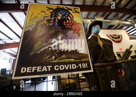 200815 -- NEW YORK, Aug. 15, 2020 -- A repurposed WWII poster adapted to the fight against COVID-19 is displayed at the Museum of American Armor in Plainview, New York, the United States, on Aug. 15, 2020. An exhibition of repurposed posters created during World War II and now adapted to the fight against COVID-19 has been held here since the museum reopened to the public on July 31, reminding visitors to be vigilant against COVID.  U.S.-NEW YORK-THE MUSEUM OF AMERICAN ARMOR-COVID-19-REPURPOSED WWII POSTERS-EXHIBITION WangxYing PUBLICATIONxNOTxINxCHN Stock Photo