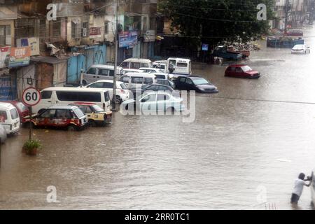 200826 -- KARACHI, Aug. 26, 2020 -- Photo taken on Aug. 25, 2020 shows a flooded road during heavy monsoon rain in the southern Pakistani city of Karachi. Heavy monsoon rains have broken a 36-year-old downpour record in the month of August in capital city Karachi of Pakistan s south Sindh province, Pakistan Meteorological Department PMD has said. The heavy rainfall has played havoc in several parts of the city where the rainwater caused flooding, submerging streets, roads, vehicles and low-lying areas. Rain-related accidents including electrocution and roof collapse also claimed lives of four Stock Photo