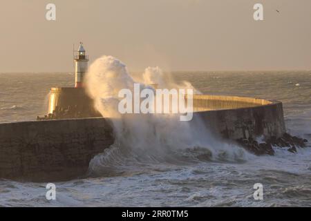 200826 -- NEWHAVEN, Aug. 26, 2020 -- Photo taken on Aug. 26, 2020 shows waves breaking over the harbour wall and lighthouse at the West Beach in Newhaven, Britain. Storm Francis continued to bring strong gusts and heavy rains to Britain. Photo by /Xinhua BRITAIN-NEWHAVEN-STORM-FRANCIS TimxIreland PUBLICATIONxNOTxINxCHN Stock Photo