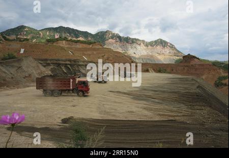 200905 -- QINHUANGDAO, Sept. 5, 2020 -- People work at a restoration site of a disused mine in Maquanzi Town of Qinglong Manchu Autonomous County, north China s Hebei Province, Sept. 5, 2020. In recent years, Qinglong Manchu Autonomous County has focused on restoring open pits and reclaimed 8,762 mu about 584 hectares of land.  CHINA-HEBEI-MINE-RESTORATION CN YangxShiyao PUBLICATIONxNOTxINxCHN Stock Photo