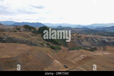 200905 -- QINHUANGDAO, Sept. 5, 2020 -- Aerial photo shows people working in a field for sowing after restoration of a disused mine in Maquanzi Town of Qinglong Manchu Autonomous County, north China s Hebei Province, Sept. 5, 2020. In recent years, Qinglong Manchu Autonomous County has focused on restoring open pits and reclaimed 8,762 mu about 584 hectares of land.  CHINA-HEBEI-MINE-RESTORATION CN YangxShiyao PUBLICATIONxNOTxINxCHN Stock Photo