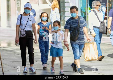 200905 -- VIENNA, Sept. 5, 2020 -- People wearing masks walk on a street in Vienna, Austria, on Sept. 5, 2020. The COVID-19 traffic light system has officially started operation in Austria, the government announced on Friday. Due to the consistently high number of new infections, Austria s three large cities -- Vienna, Linz and Graz -- as well as the Tyrolean district of Kufstein light up in yellow medium risk, while the rest of the country is designated green low risk, according to a press conference held by Chancellor Sebastian Kurz and other government officials. Photo by /Xinhua AUSTRIA-VI Stock Photo