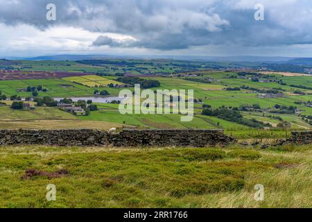 Rolling countryside of the West Yorkshire Pennines near Oxenhope. The nearest building is Dyke Nook, Hebden Bridge Rd, Oxenhope, Keighley BD22 9QE Stock Photo