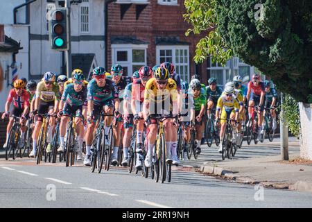 The peloton on Stage 2 of the Tour of Britain 2023 passes through Rossett, Wales Stock Photo