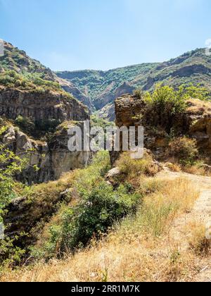 cliffs and mountains near medieval rock monastery of Geghard on sunny summer day, Armenia Stock Photo