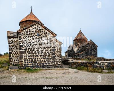 Surp arakelots and Surp Astvatsatsin churches of Sevanavank Sevan Monastery on overcast summer day, Armenia Stock Photo
