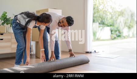 Couple Indian moving into a new house, Relocation, moving to new home concept Stock Photo