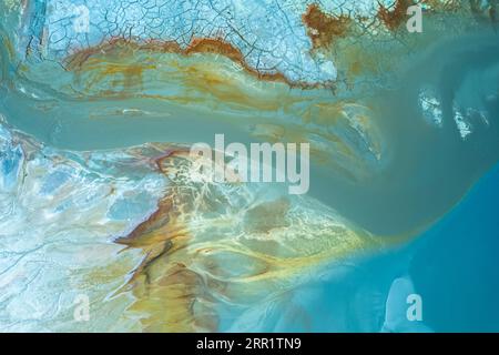 Textured background of blue surface with cracked waving areas and and brown spots Stock Photo
