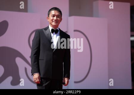 Tony Leung Chiu-wai attends a red carpet for the Golden Lion For Lifetime Achievement Award & ''The Lion's Share: A History Of The Mostra'' at the 80th Venice International Film Festival on September 02, 2023 in Venice, Italy (Photo by Luca Carlino/NurPhoto)0 Stock Photo