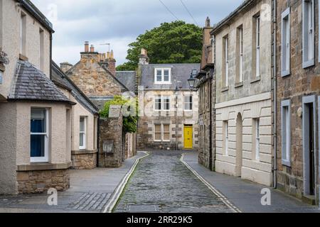 Old stone houses, cobbled streets in the old town of St Andrews, County Fife, Scotland, United Kingdom Stock Photo