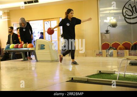 201008 -- KABUL, Oct. 8, 2020 -- An Afghan girl plays bowling during a competition at a club in Kabul, Afghanistan, Oct. 8, 2020. Photo by /Xinhua SPAFGHANISTAN-KABUL-BOWLING CLUB-WOMEN SayedxMominzadah PUBLICATIONxNOTxINxCHN Stock Photo