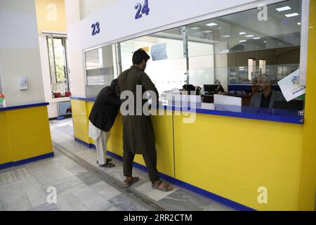 201008 -- KABUL, Oct. 8, 2020 -- People wait to receive their mails at a post office ahead of World Post Day in Kabul, capital of Afghanistan, Oct. 8, 2020. Photo by /Xinhua AFGHANISTAN-KABUL-WORLD POST DAY SayedxMominzadah PUBLICATIONxNOTxINxCHN Stock Photo
