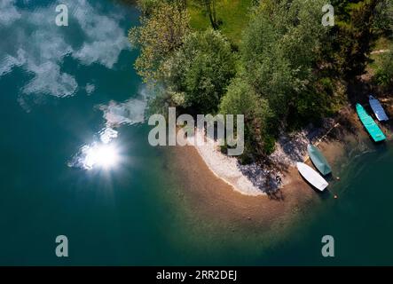 Drone shot, panorama shot, clouds floating in the water with fishing boats at the Irrsee, Zell am moss, Salzkammergut, Upper Austria, Austria Stock Photo