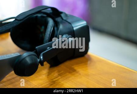Close up image of Virtual Reality Googles with copy space in wood background Stock Photo