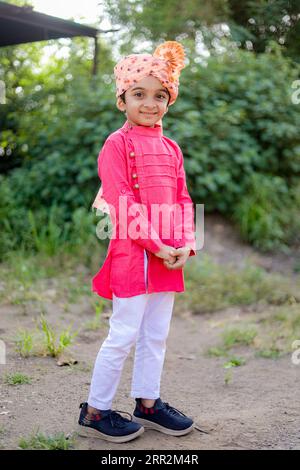 happy indian farmer son Wear sehra, maharashtrian kids, happy rular kids Stock Photo