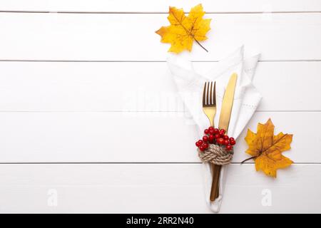 Autumn table setting on white wooden table Thanksgiving or Octoberfest vintage background copy space Stock Photo