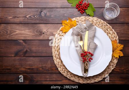 Autumn table setting on old wooden table Thanksgiving or Octoberfest vintage background copy space Stock Photo