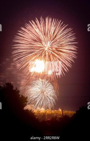 Closing fireworks of the Bergstadtfest at the Reiche Zeche above the towers of Freiberg Stock Photo