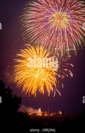 Closing fireworks of the Bergstadtfest at the Reiche Zeche above the towers of Freiberg Stock Photo