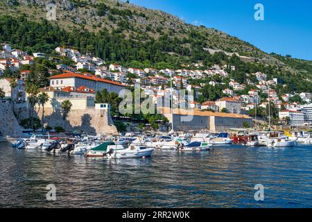 Boats moored in the marina at Dubrovnik harbour in old walled city of Dubrovnik on the Dalmatian Coast of Croatia Stock Photo
