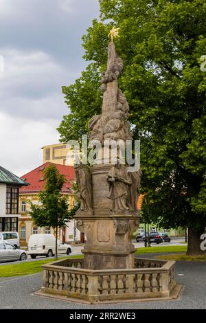 Sluknov (German Schluckenau) is a town in the Okres Decin in the Ustecky kraj in the Czech Republic. Market square with the Holy Trinity Column Stock Photo