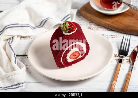 Strawberry and cream roll cake. Delicious cake with whipped cream and strawberries Stock Photo