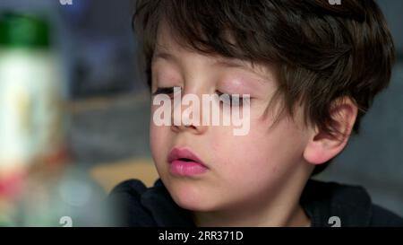 Youngster's Distanced Gaze and Evident Boredom, Rolling Eyes. bored kid