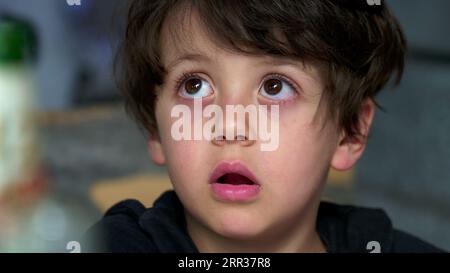 Youngster's Distanced Gaze and Evident Boredom, Rolling Eyes. bored kid
