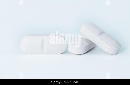 Close-up white pills tablets isolated on white background with clipping path. Stock Photo