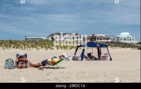 People Sitting on The Long Beach Island Beach Surf City New Jersey USA Stock Photo