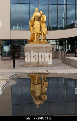 tatue of James Watt, Matthew Boulton and William Murdock.Golden boys in Centenary Square.  Birmingham UK Stock Photo