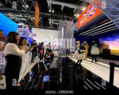 Beijing, China. 4th Sep, 2023. This cellphone photo shows visitors watching a show at the booth of Britain during the 2023 China International Fair for Trade in Services (CIFTIS) in Beijing, capital of China, Sept. 4, 2023. TO GO WITH 'China Focus: Countries along Belt and Road share service trade dividends' Credit: Wei Mengjia/Xinhua/Alamy Live News Stock Photo