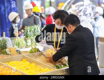 201103 -- BEIJING, Nov. 3, 2020 -- Staff members work at the food exhibition area of the 3rd China International Import Expo CIIE in east China s Shanghai, Nov. 2, 2020. The third CIIE will be held from Nov. 5 to 10 in Shanghai.  XINHUA PHOTOS OF THE DAY DingxTing PUBLICATIONxNOTxINxCHN Stock Photo