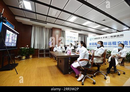 201112 -- BEIJING, Nov. 12, 2020 -- Experts from the First Affiliated Hospital of Guangxi Medical University attend a video conference with medical staff in Cambodia to share specific COVID-19 prevention and control measures, in Nanning, south China s Guangxi Zhuang Autonomous Region, April 20, 2020. China s trade with the Association of Southeast Asian Nations ASEAN in the first three quarters of the year reached 481.8 billion U.S. dollars, accounting for one seventh of China s foreign trade, and bilateral trade grew 7.7 percent in the 3rd quarter, Chinese Ambassador to ASEAN Deng Xijun said Stock Photo