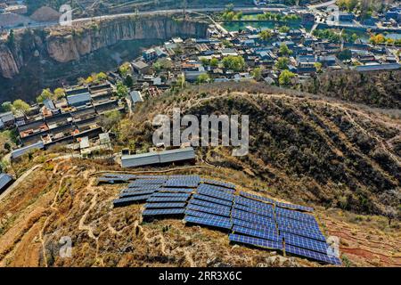 201113 -- TAIYUAN, Nov. 13, 2020 -- Aerial photo taken on Nov. 11, 2020 shows photovoltaic power generators in Hongni Village in Pingshun County, north China s Shanxi Province. In the past, Hongni Village, located in the deep Taihang Mountains, suffered from inconvenient transportation, lack of resources, and poor production and living conditions. More than one third of the villagers lived in poverty, and many people left their hometown to work outside. To change the situation, Hongni Village started promoting local tourism, improving the infrastructure and creating jobs for underprivileged vi Stock Photo