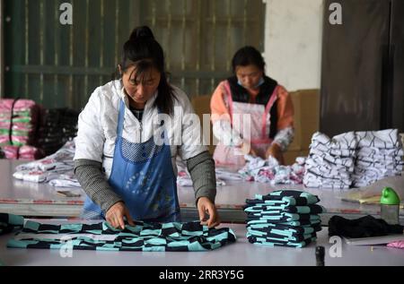 201114 -- HEZE, Nov. 14, 2020 -- Employees package the costumes for sale to Japan at Sunzhuang Village of Caoxian County in Heze, east China s Shandong Province, Nov. 9, 2020. Sunzhuang Village thrives on e-commerce business. Among some 760 households in the village, more than 560 run online clothes stores on Taobao.com, Alibaba s main e-commerce site. The village s sales volume of costumes exceeded 200 million yuan about 30.22 million U.S. dollars in 2019.  CHINA-SHANDONG-HEZE-ONLINE BUSINESS CN WangxKai PUBLICATIONxNOTxINxCHN Stock Photo