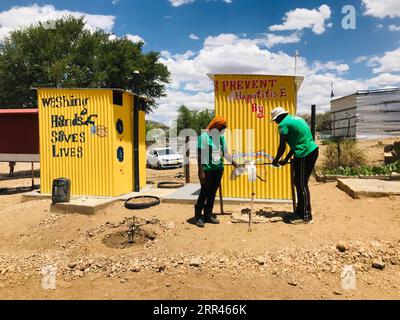 201121 -- WINDHOEK, Nov. 21, 2020 -- Community volunteers inspect sanitation facilities in Nalitungwe informal settlement in Windhoek, Namibia, Nov. 20, 2020. A community-led total sanitation initiative in informal settlements on the outskirts of Namibian capital, Windhoek, is promoting community hygiene and public health. Photo by /Xinhua NAMIBIA-WINDHOEK-COMMUNITY HYGIENE NdalimpingaxIita PUBLICATIONxNOTxINxCHN Stock Photo