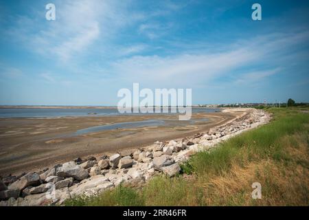 Nikopol city, Dnipropetrovsk Oblast with terrible Disaster Ecocide landscape of dried up Kakhovka Reservoir near Enerhodar as result of Kakhovka Dam d Stock Photo