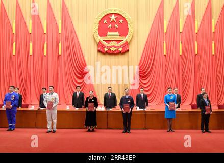 201124 -- BEIJING, Nov. 24, 2020 -- Xi Jinping and other leaders of the Communist Party of China and the state present honorary certificates to representatives of the awardees at a gathering to honor model workers and exemplary individuals at the Great Hall of the People in Beijing, capital of China, Nov. 24, 2020.  CHINA-BEIJING-XI JINPING-MODEL WORKERS-EXEMPLARY INDIVIDUALS-GATHERING CN LixXueren PUBLICATIONxNOTxINxCHN Stock Photo