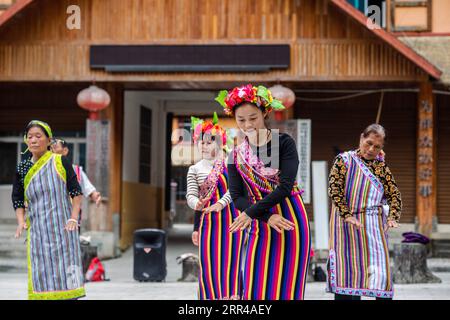 201127 -- KUNMING, Nov. 27, 2020 -- Dulong residents dance on a square in Dulongjiang Township of Gongshan Dulong and Nu Autonomous County, southwest China s Yunnan Province, Oct. 31, 2020. Dulong is a mountain-dwelling ethnic group in southwest China. It is one of the least populous of China s 56 minority nationalities. It is also called a direct-transition minority ethnic group because the Dulong people didn t bid farewell to primitive life until the founding of the People s Republic of China in 1949 and since then they directly stepped into the socialist society. Most Dulong people live in Stock Photo