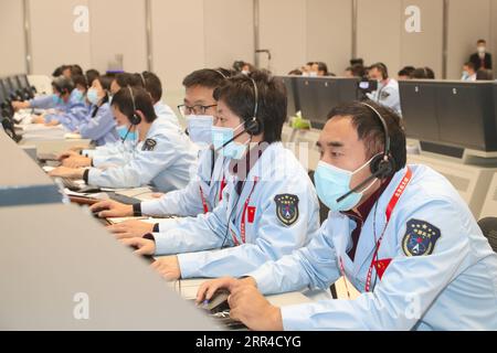 201129 -- BEIJING, Nov. 29, 2020  -- Technical personnel work at the Beijing Aerospace Control Center BACC in Beijing, capital of China, Nov. 29, 2020. China s Chang e-5 probe performed braking for the second time at 20:23 p.m. Sunday Beijing Time, according to the China National Space Administration CNSA. After the deceleration, the probe started flying in a near circular orbit from an elliptical path around the moon, said the CNSA. BACC/Handout via  EyesonSciCHINA-CHANG E-5 PROBE-DECELERATION CN Xinhua PUBLICATIONxNOTxINxCHN Stock Photo