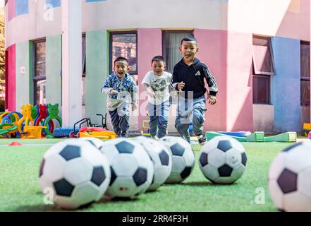 201202 -- LHASA, Dec. 2, 2020 -- File photo taken on Aug. 22, 2019 shows children from the Experimental Kindergarten of Tibet Autonomous Region having a football training session in Lhasa. The Chinese government has, so far, spent more than 20 billion yuan on supporting the region s free education program, making education more accessible for nearly nine million students. Students across all grades can also access additional support through a number of projects and initiatives under 40 educational aid projects, providing grants and scholarships, among others.  CHINA-TIBET-FREE EDUCATION CN Sun Stock Photo