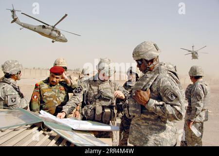 Iraq: U.S. Army Lt. General Lloyd J. Austin III, right, commander of XVIII Airborne Corps, speaks with Col. Jeffrey L. Bannister, center, and Iraqi Brig. Gen. Abdulah, left, during a field meeting September 11, 2007 outside Baghdad, Iraq. Credit Image: /Planet Pix via ZUMA Wire U.S. Army Gen. Lloyd J. Austin III Spc.xNicholasxA.xHernandez/UsxAr PUBLICATIONxNOTxINxCHN Lloyd.Austin 20070911 095.jpg Stock Photo