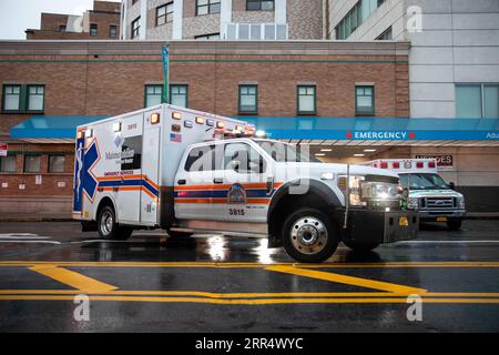 201215 -- NEW YORK, Dec. 15, 2020 -- An ambulance arrives in front of the emergency room entrance at Maimonides Medical Center during the COVID-19 pandemic in the Brooklyn borough of New York, United States, Dec. 14, 2020. The United States reached the grim milestone of 300,000 coronavirus deaths on Monday, according to the Center for Systems Science and Engineering CSSE at Johns Hopkins University. With the national case count topping 16.3 million, the death toll across the United States rose to 300,267 as of 3:26 p.m. local time 2026 GMT, according to the CSSE data. Photo by /Xinhua U.S.-NEW Stock Photo
