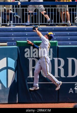 Milwaukee Brewers' Tyrone Taylor (15) removes his helmet after striking out  during the third inning of a baseball game against the Miami Marlins,  Friday, May 7, 2021, in Miami. (AP Photo/Lynne Sladky