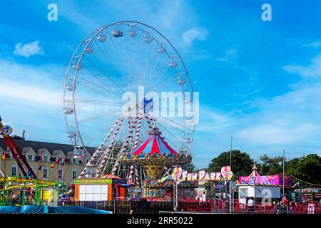 The Fun Park in Salthill, Galway, Ireland with the chairoplane towering above the park. Stock Photo