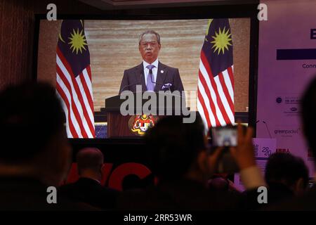 201221 -- KUALA LUMPUR, Dec. 21, 2020  -- Malaysian Prime Minister Muhyiddin Yassin delivers a speech via video during the World Chinese Economic Summit 2020 in Kuala Lumpur, Malaysia, Dec. 21, 2020. China has played a significant role in upholding the international trading system and opposing protectionism and unilateralism since the outbreak of COVID-19, Malaysian Prime Minister Muhyiddin Yassin said on Monday. TO GO WITH China has played significant role in upholding int l trading system: Malaysian PM  MALAYSIA-KUALA LUMPUR-WORLD CHINESE ECONOMIC SUMMIT Xinhua PUBLICATIONxNOTxINxCHN Stock Photo