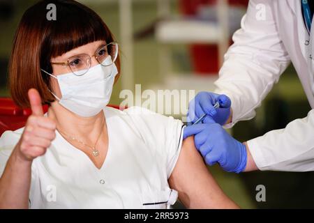 201227 -- WARSAW, Dec. 27, 2020 -- Alicja Jakubowska, head nurse of the Central Clinical Hospital of the Ministry of the Interior MSWiA, receives coronavirus vaccination in Warsaw, Poland, on Dec. 27, 2020. Photo by /Xinhua POLAND-WARSAW-COVID-19-VACCINATION JaapxArriens PUBLICATIONxNOTxINxCHN Stock Photo